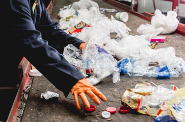 Photo of Someone Sorting Recycling